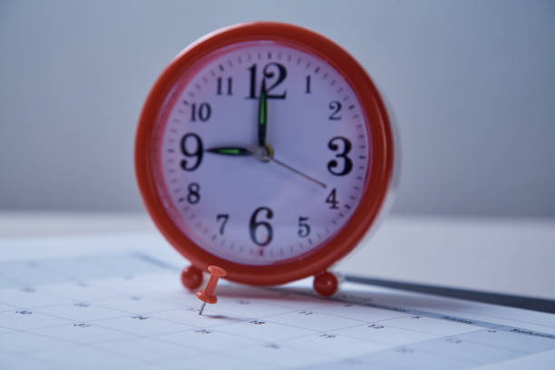 istock Time management deadline and schedule concept: alarm clock on schedule plan 1165721501