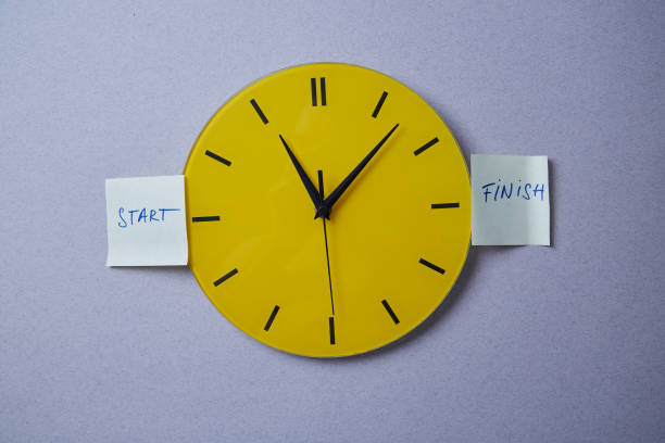istock Time management deadline and schedule concept: yellow clock covered with stickers 1165721550