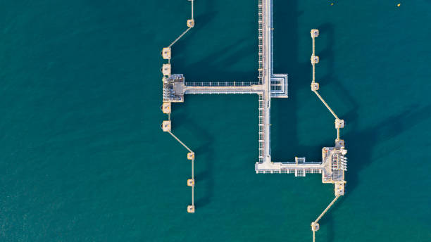 Aerial view crude oil and gas terminal, Loading arm oil and gas refinery at commercial port. Aerial view crude oil and gas terminal, Loading arm oil and gas refinery at commercial port. lng liquid natural gas stock pictures, royalty-free photos & images