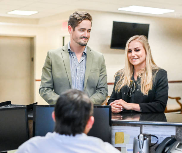 istock Couple at a reception desk, waiting room or office 1165722216