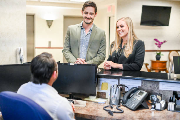 istock Couple at a reception desk, waiting room or office 1165722255