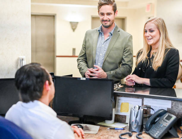 istock Couple at a reception desk, waiting room or office 1165722286