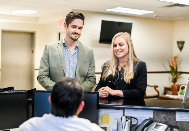 istock Couple at a reception desk, waiting room or office 1165722288
