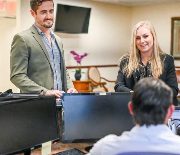 istock Couple at a reception desk, waiting room or office 1165722303