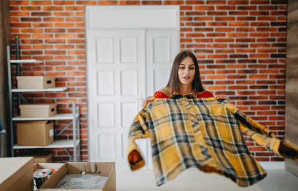 Young woman packing goods for shipment