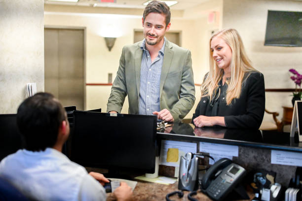 istock Couple at a reception desk, waiting room or office 1165722953