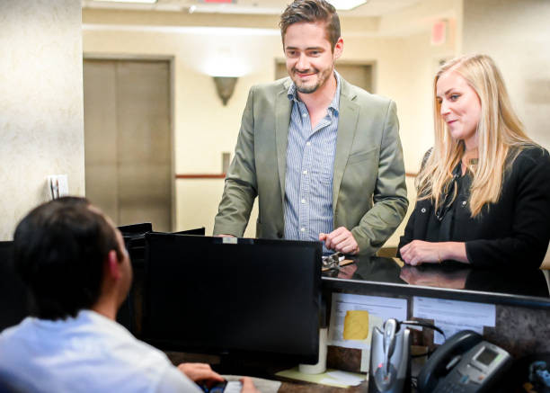 istock Couple at a reception desk, waiting room or office 1165723046