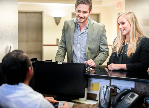 istock Couple at a reception desk, waiting room or office 1165723084