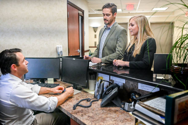 istock Couple at a reception desk, waiting room or office 1165723266