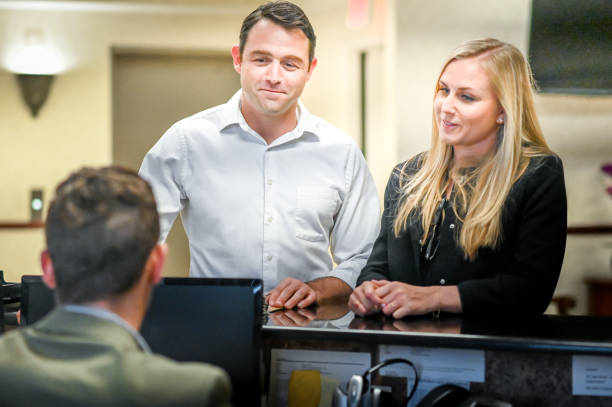 istock Couple at a reception desk, waiting room or office 1165723272