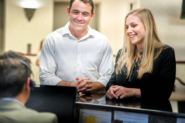 istock Couple at a reception desk, waiting room or office 1165723672
