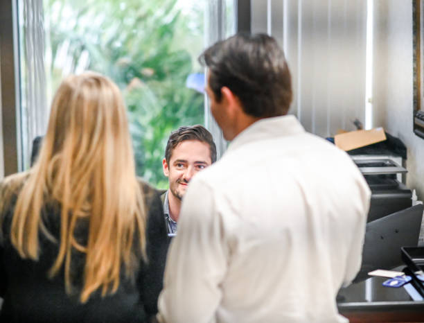 istock Couple at a reception desk, waiting room or office 1165723675