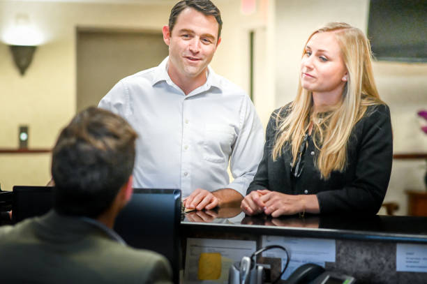 istock Couple at a reception desk, waiting room or office 1165724457