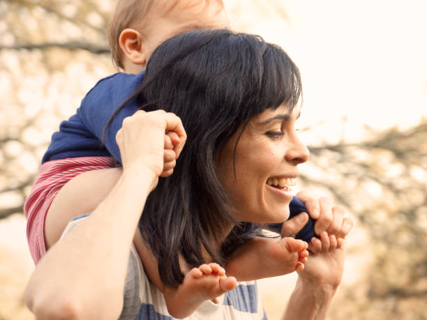istock mother and children strolling outdoors 1165726432