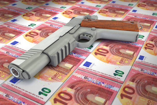 istock euro banknotes corruption and gun 1165727030