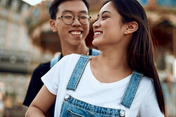 istock Young happy asian couple having fun together 1165729224