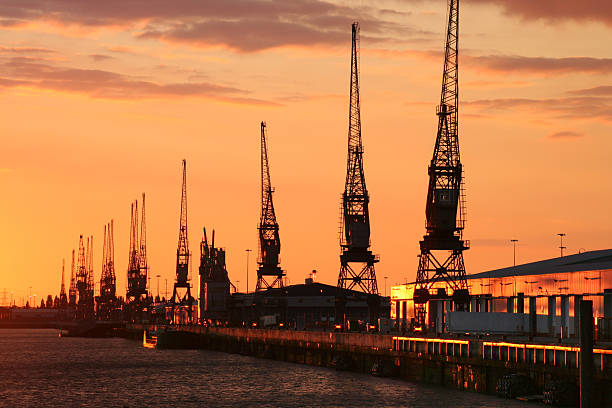 Southampton Docks at sunset No filters, no recolouring, just an amazing sunset bathing Southampton Docks in golden red light. Taken from Mayflower Park. hampshire england photos stock pictures, royalty-free photos & images