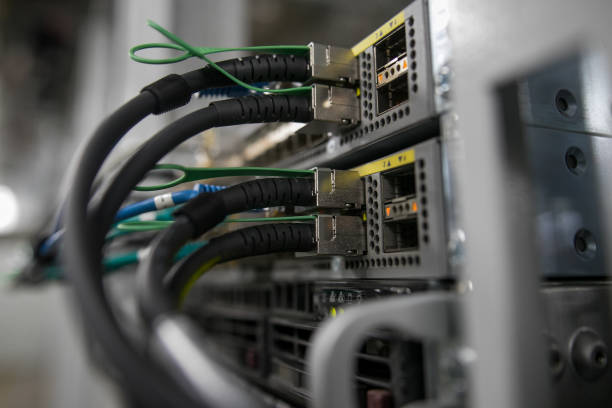 istock Fiber Optical connector interface. Fibre Channel swich. Severs computer in a rack at the large data center. 1165729764