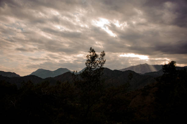 istock Landscape of the mountain under the cloudy sky with light 1165729796