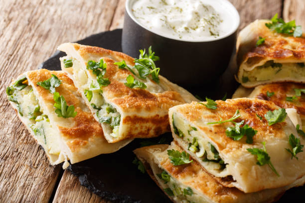 istock Afghan fried flat breads with potatoes, green onions and cilantro closeup. horizontal 1165730748