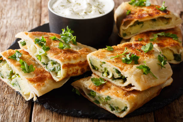 istock Afghani Bolani with mashed potato & Green Onions served with plain yogurt closeup. horizontal 1165730791