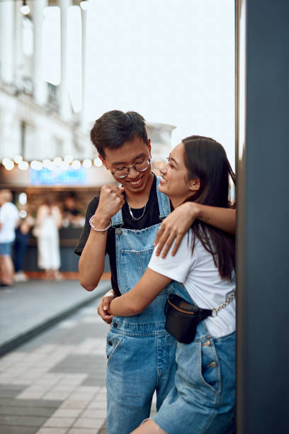 istock Young happy asian couple having fun together 1165730857