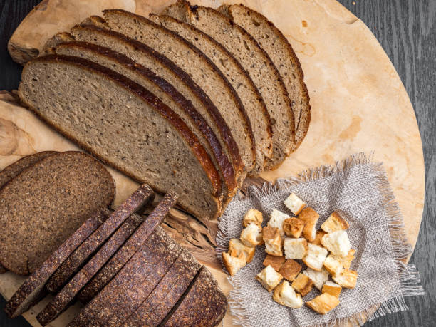 istock Dark rue bread on a wooden background 1165731330