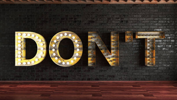 istock Don't and Do Light Bulb Sign on Black Wall 1165735181