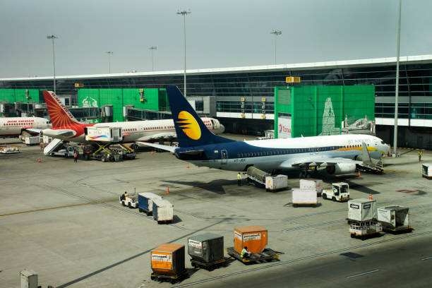 Indira Gandhi International Airport at Delhi city on March 24, 2019 in New Delhi, India Aircraft and indian people prepare to take off and loading baggage to plane in Indira Gandhi International Airport at Delhi city on March 24, 2019 in New Delhi, India india airport stock pictures, royalty-free photos & images
