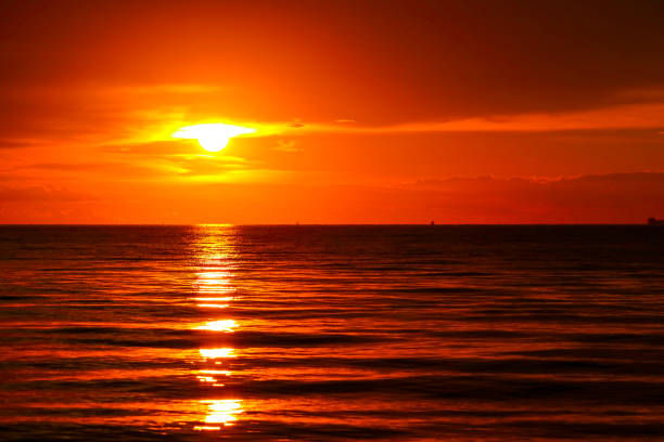 istock sunset on sea and ocean last light red sky silhouette cloud 1165736883