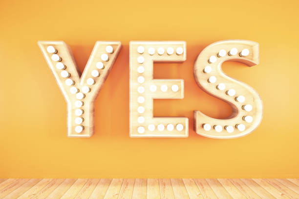 istock Yes Light Bulb Sign on Orange Background 1165741339