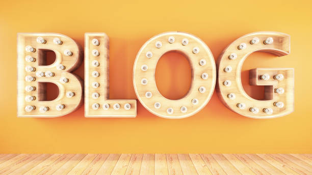 istock Retro Blog Light Bulb Sign on Orange Wall 1165741630