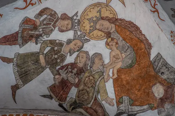 the three holy kings bring gold, frankincense and myrrh to Jesus, a wall-painting from about the year 1500 in the church of St. Mary, Elsinore, Denmark, May 14, 2019