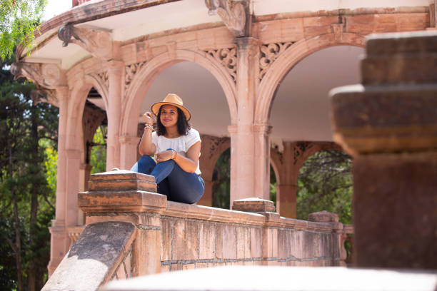istock Latin woman as a tourist 1165742777