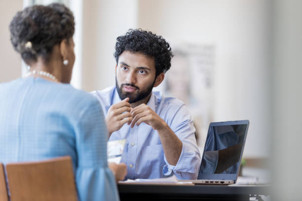 istock Personal banker listens as client raises concerns 1165742844