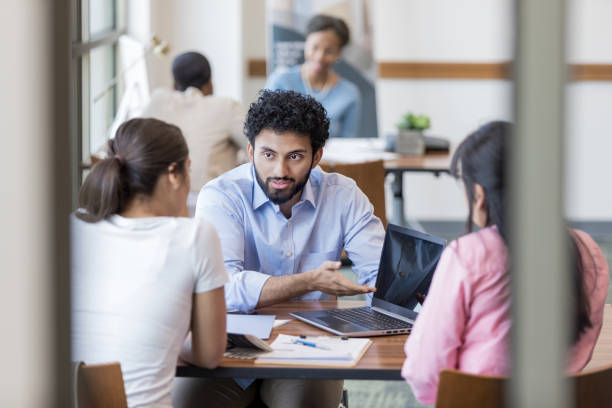 Personal banker instructs clients concerning online banking