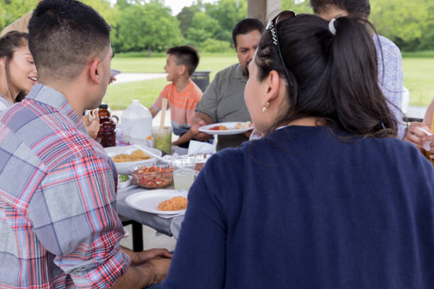 istock Large family sharing meal together 1165743020