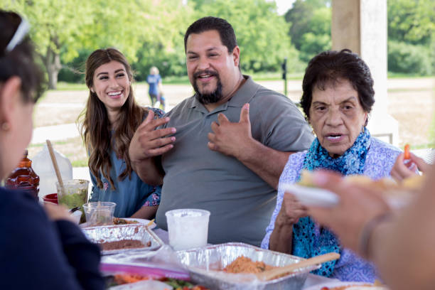istock Mature Hispanic man enjoys time with family 1165743031