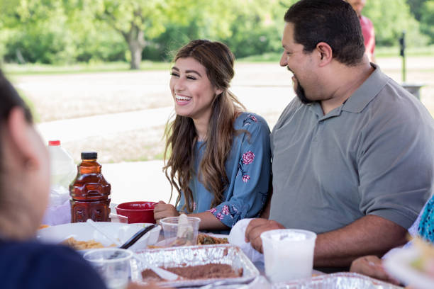 istock Beautiful young woman enjoys picnic 1165743033