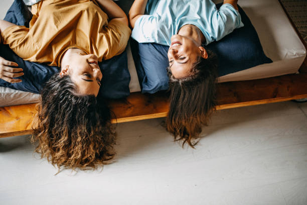istock Young women having fun at home 1165745384