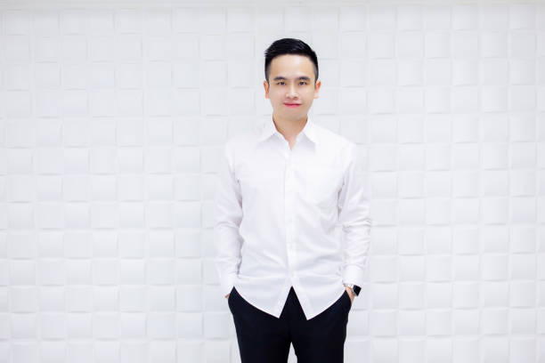 Portrait of Asian handsome business man in the white shirt close up.