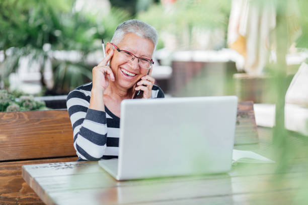 istock Senior Woman sitting in a cafe 1165753723