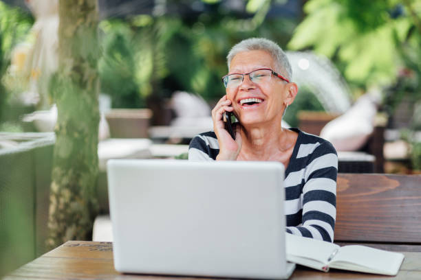 istock Senior Woman sitting in a cafe 1165753753