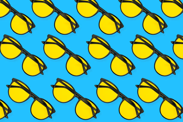 Summer pattern of sunglasses on pastel blue background. Minimal summer concept.