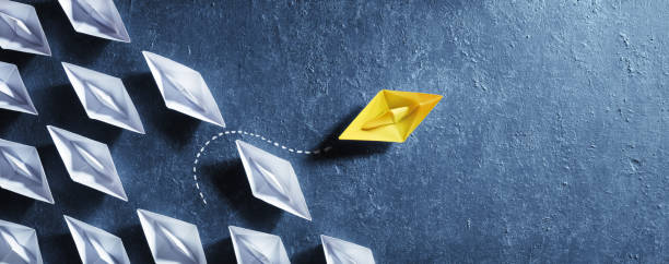 istock Opportunities Business Concept - Paper Boat Change Direction 1165754666