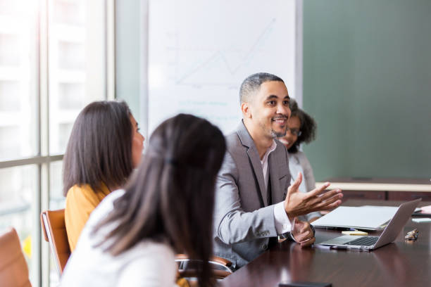 istock Businessman gestures during meeting 1165754878