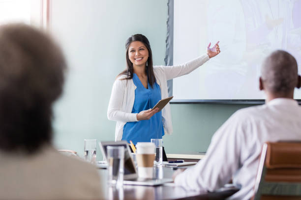 istock Confident businesswoman gives presentation 1165754889