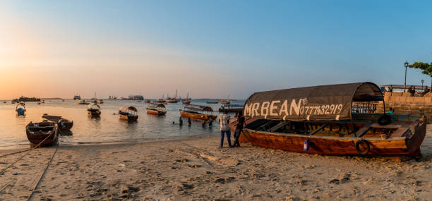 Boats at beach in Zanzibar on Indian Ocean stock photo