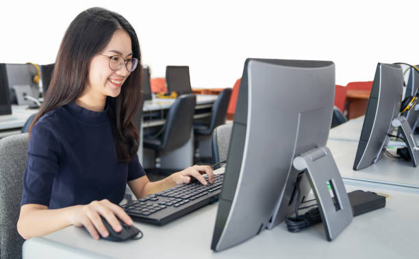 istock Back to school education knowledge college university concept, Young people being used computer and tablet, Education and technology concept. 1165756317
