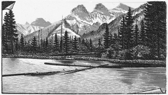 The Three Sisters mountains in the Canadian Rockies of Alberta, Canada. Vintage etching circa late 19th century. Alberta became a province in 1905, until then it was part of the Northwest Territories.